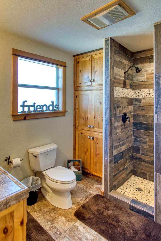 6446 Blackjack Road Fredonia, TX 76842 - Photo 48 of 52 a bathroom with a toilet shower and a sink