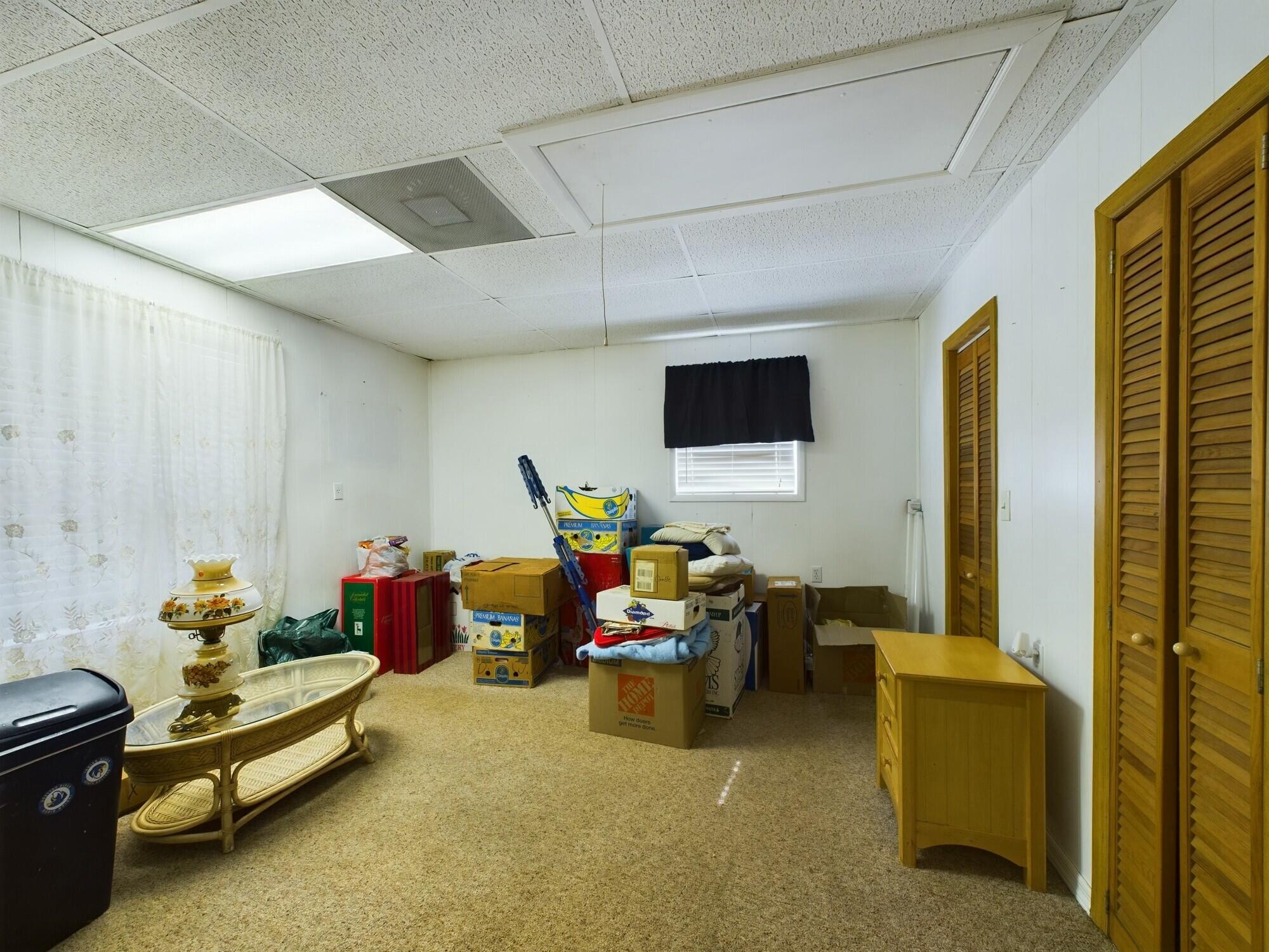 1517 Southwest 7th Avenue Okeechobee, FL 34974 - Photo 38 of 51 a living room with furniture flowerpot and a flat screen tv