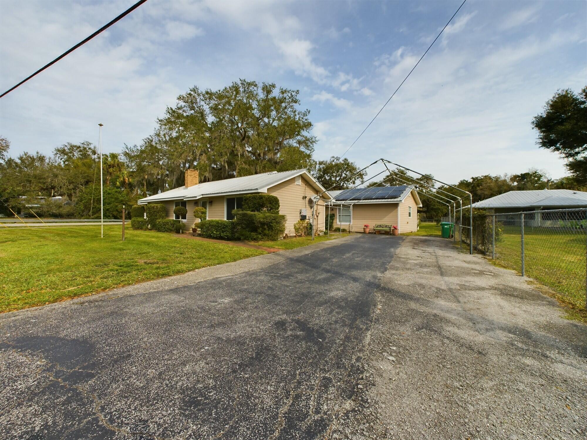 1517 Southwest 7th Avenue Okeechobee, FL 34974 - Photo 51 of 51 a view of a house with a yard