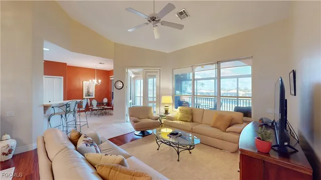 a living room with furniture fireplace and a flat screen tv