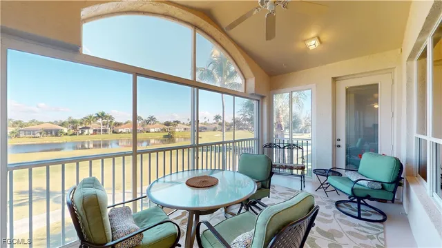 a view of a room with furniture wooden floor and windows