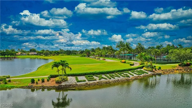 a view of a swimming pool with an outdoor space and seating area