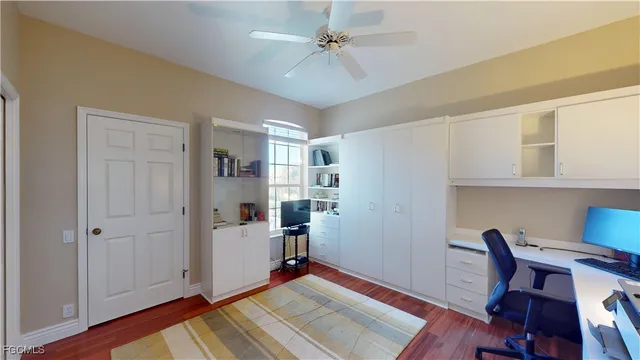 a bedroom with a workspace