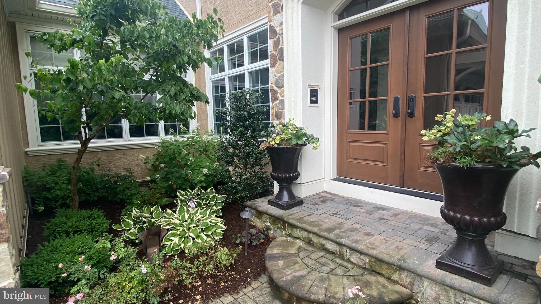 206 Valley Ridge Road Haverford, PA 19041 - Photo 2 of 48 a view of a backyard with potted plants