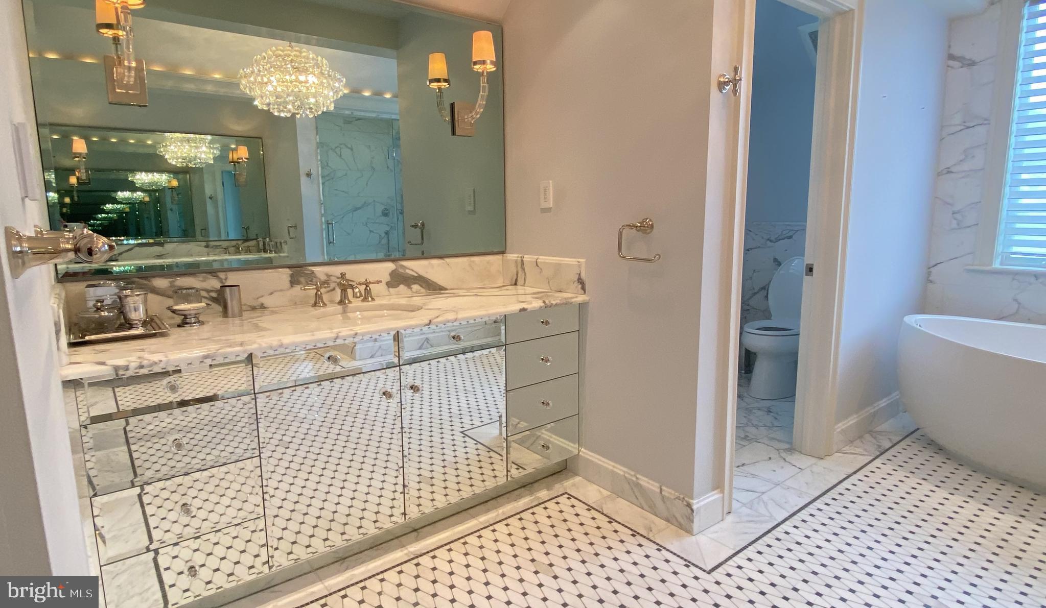 206 Valley Ridge Road Haverford, PA 19041 - Photo 26 of 48 a bathroom with a sink a mirror and a shower