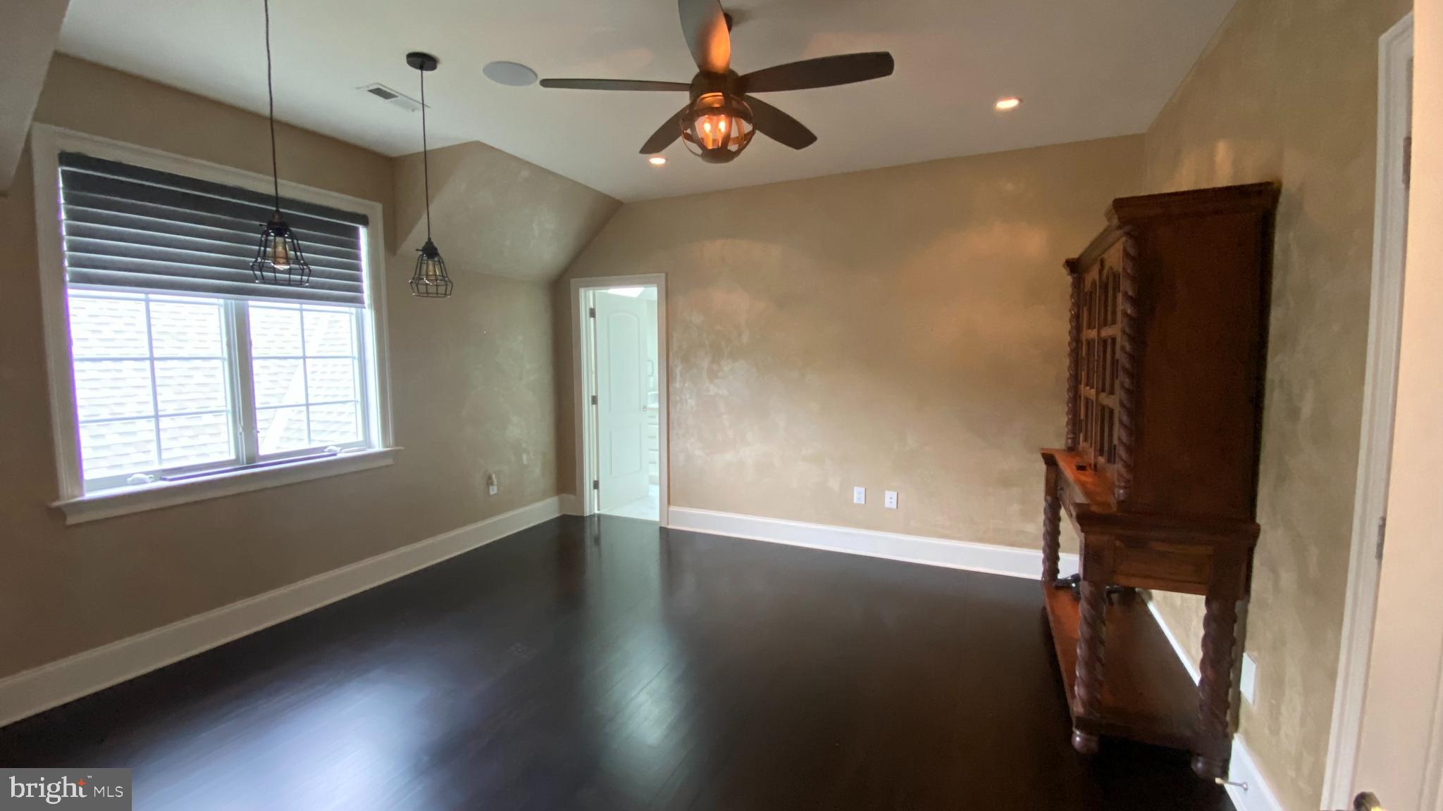 206 Valley Ridge Road Haverford, PA 19041 - Photo 33 of 48 a view of empty room with wooden floor and fan
