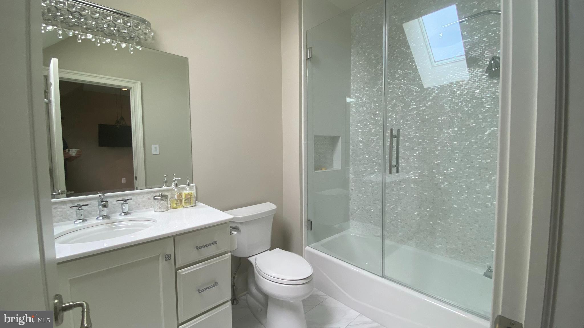 206 Valley Ridge Road Haverford, PA 19041 - Photo 34 of 48 a bathroom with a shower sink vanity mirror and toilet