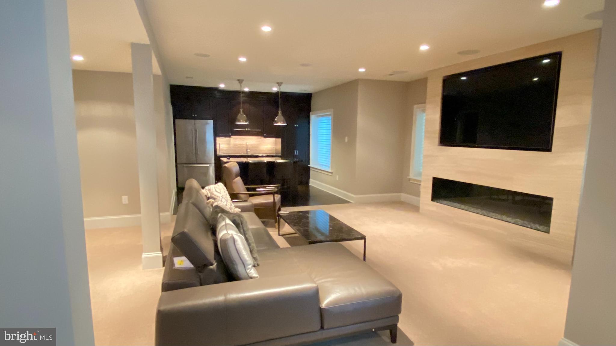 206 Valley Ridge Road Haverford, PA 19041 - Photo 40 of 48 a living room with furniture and a flat screen tv