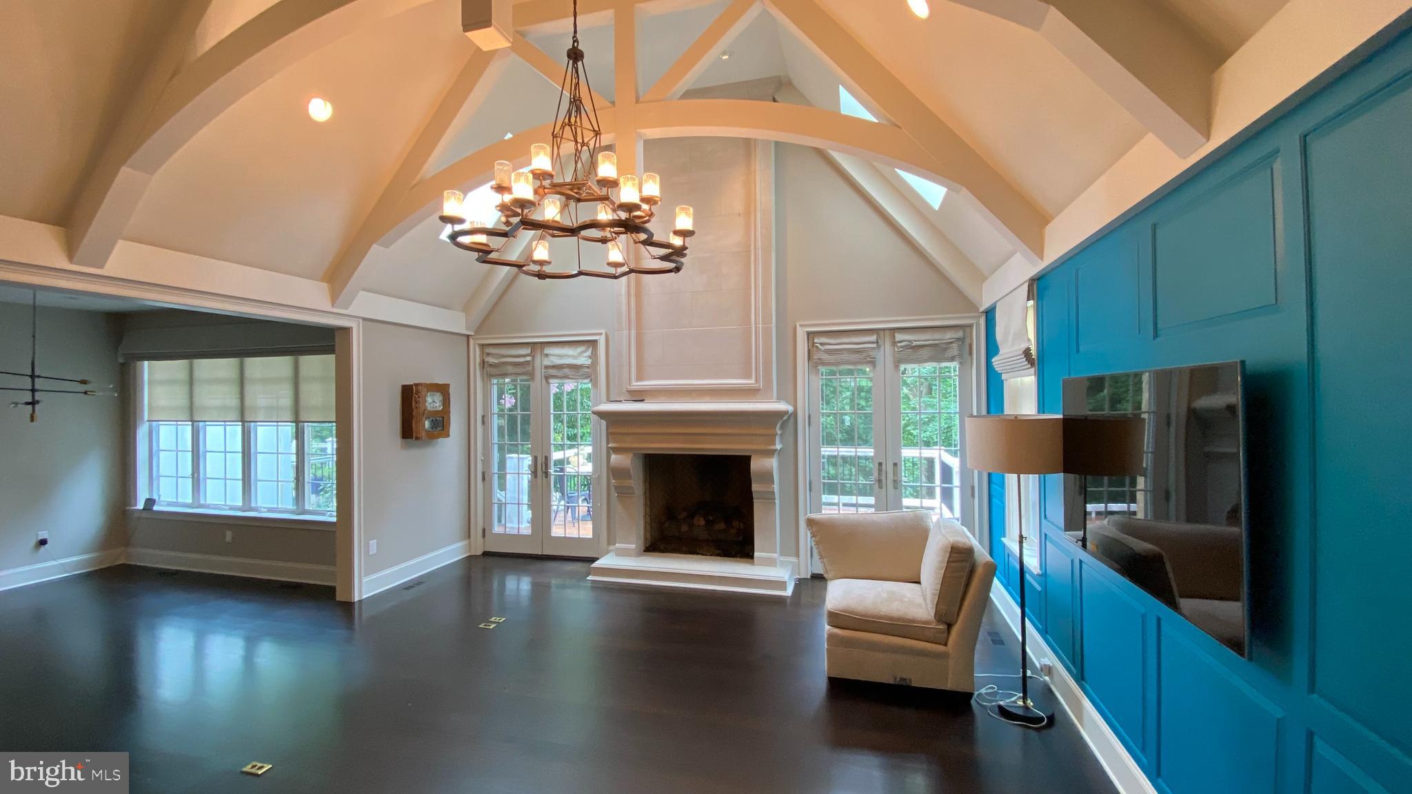 206 Valley Ridge Road Haverford, PA 19041 - Photo 4 of 48 a living room with furniture wooden floor and a fireplace