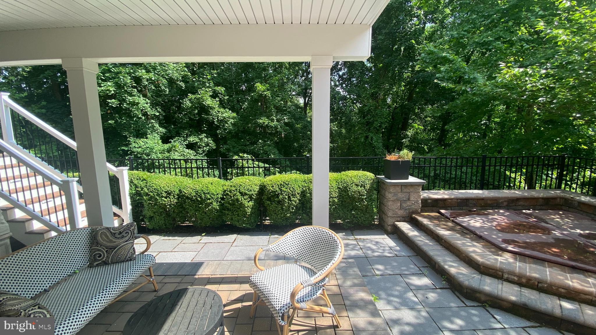 206 Valley Ridge Road Haverford, PA 19041 - Photo 45 of 48 a view of a patio with table and chairs potted plants with floor to ceiling window