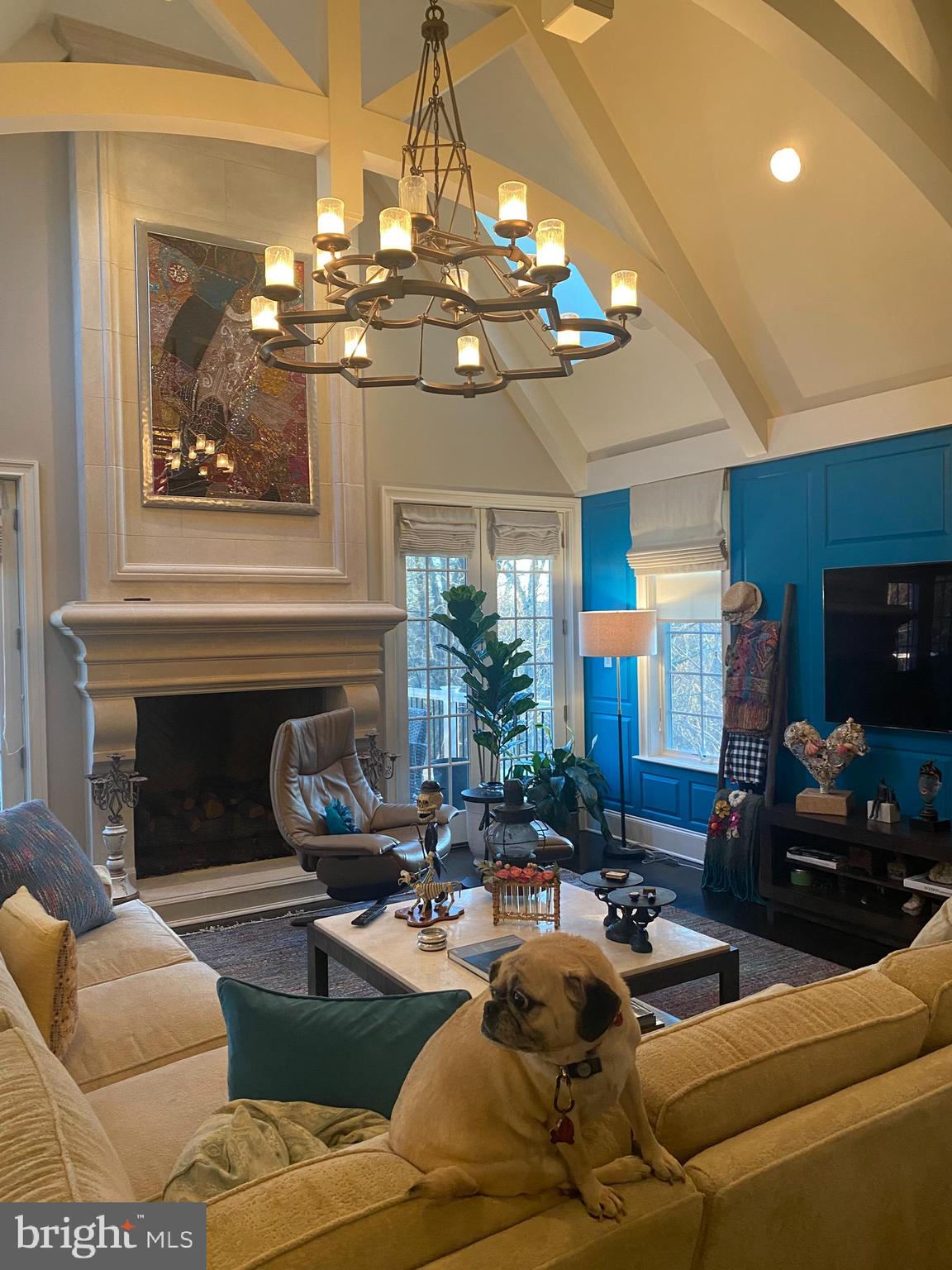 206 Valley Ridge Road Haverford, PA 19041 - Photo 6 of 48 a living room with furniture a chandelier and a fireplace