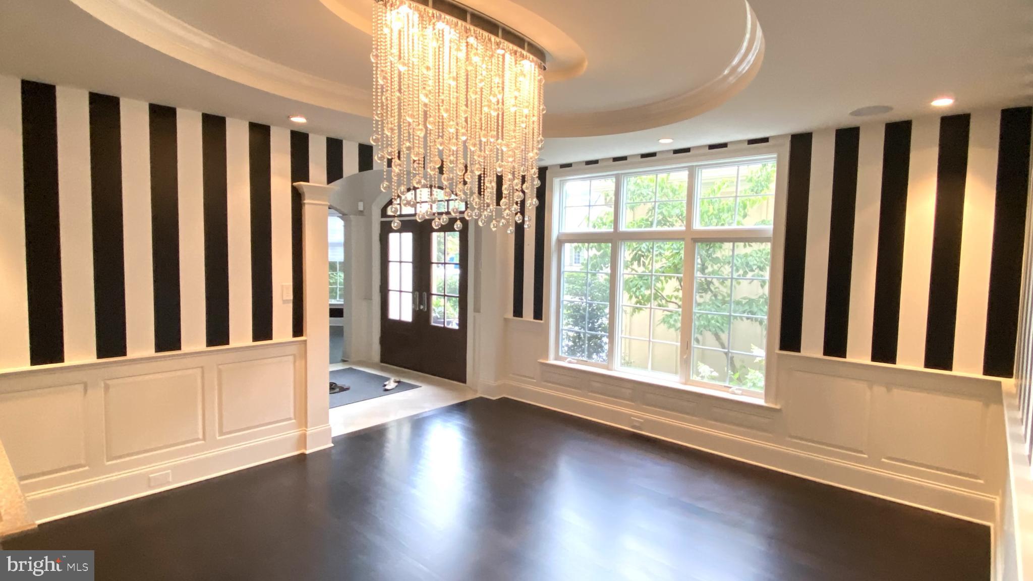 206 Valley Ridge Road Haverford, PA 19041 - Photo 9 of 48 an empty room with wooden floor and windows