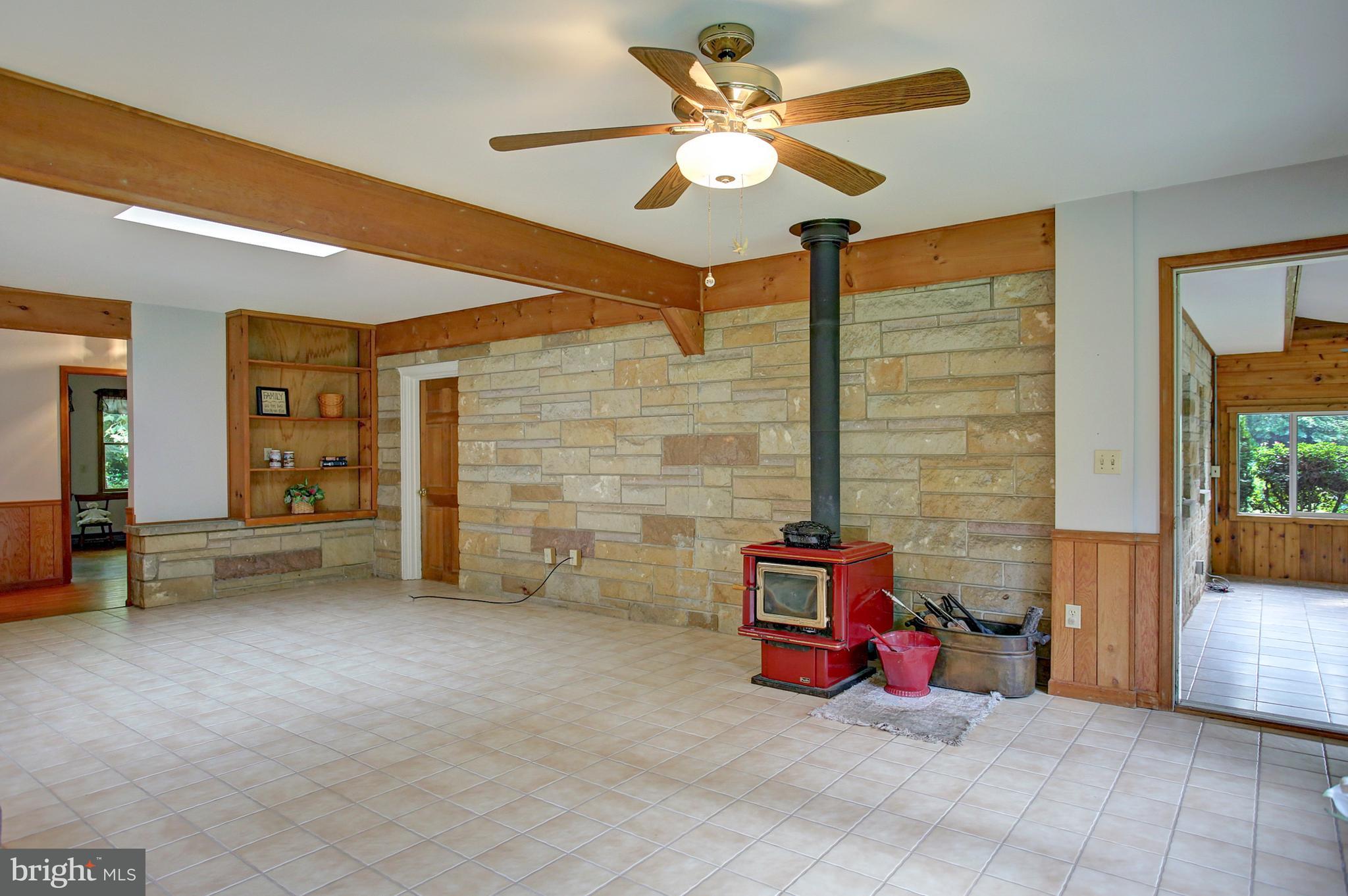 320 Pine Road Carlisle, PA 17015 - Photo 33 of 95 Large family room with stove, builtin bookshelves