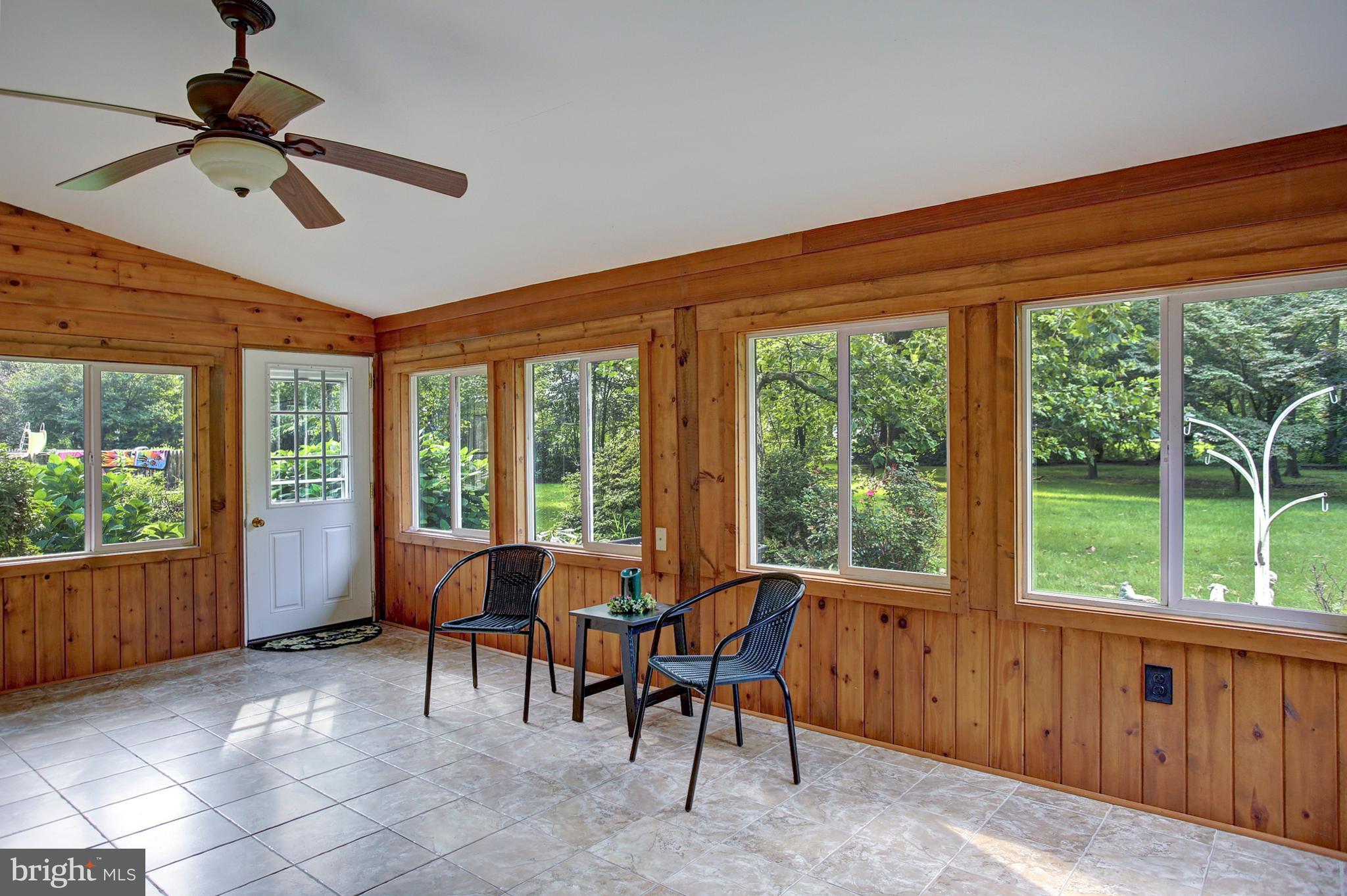 320 Pine Road Carlisle, PA 17015 - Photo 34 of 95 Sunroom - great space to come in from the pool!