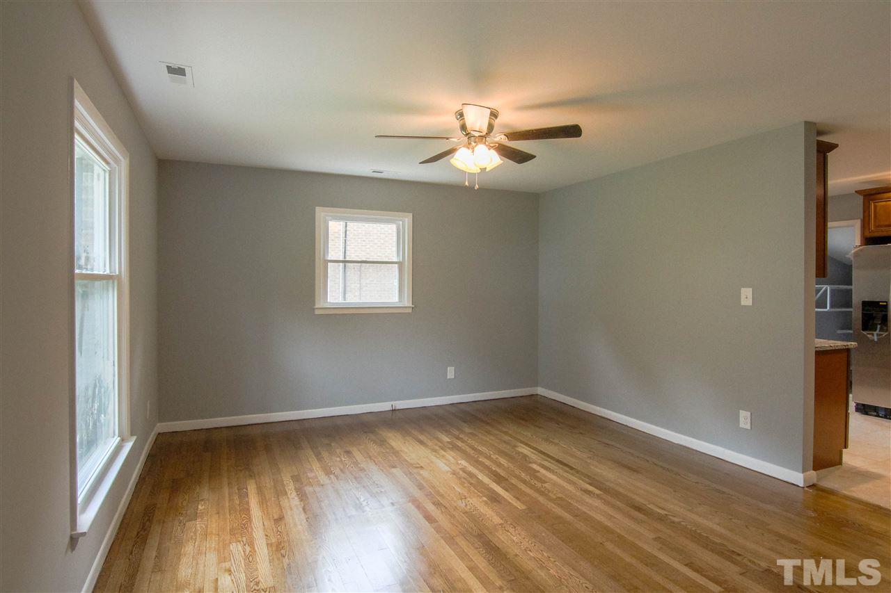 4608 Huntington Court Raleigh, NC 27609 - Photo 2 of 10 wooden floor in an empty room with a window