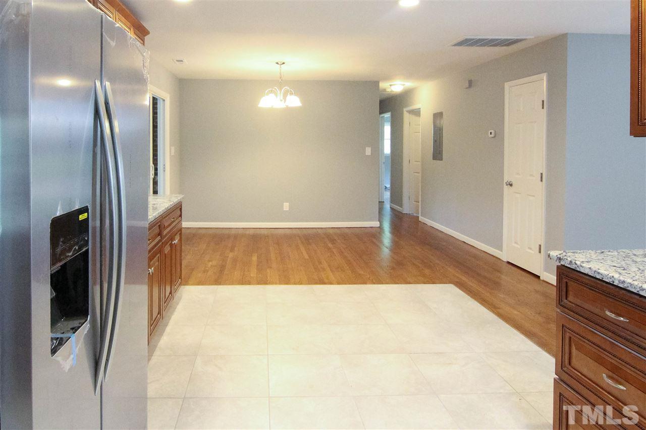4608 Huntington Court Raleigh, NC 27609 - Photo 6 of 10 a view of a hallway with wooden floor