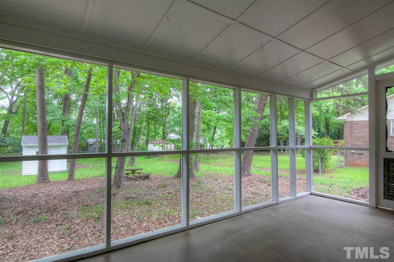 4608 Huntington Court Raleigh, NC 27609 - Photo 9 of 10 a view of a room with a large trees and plants