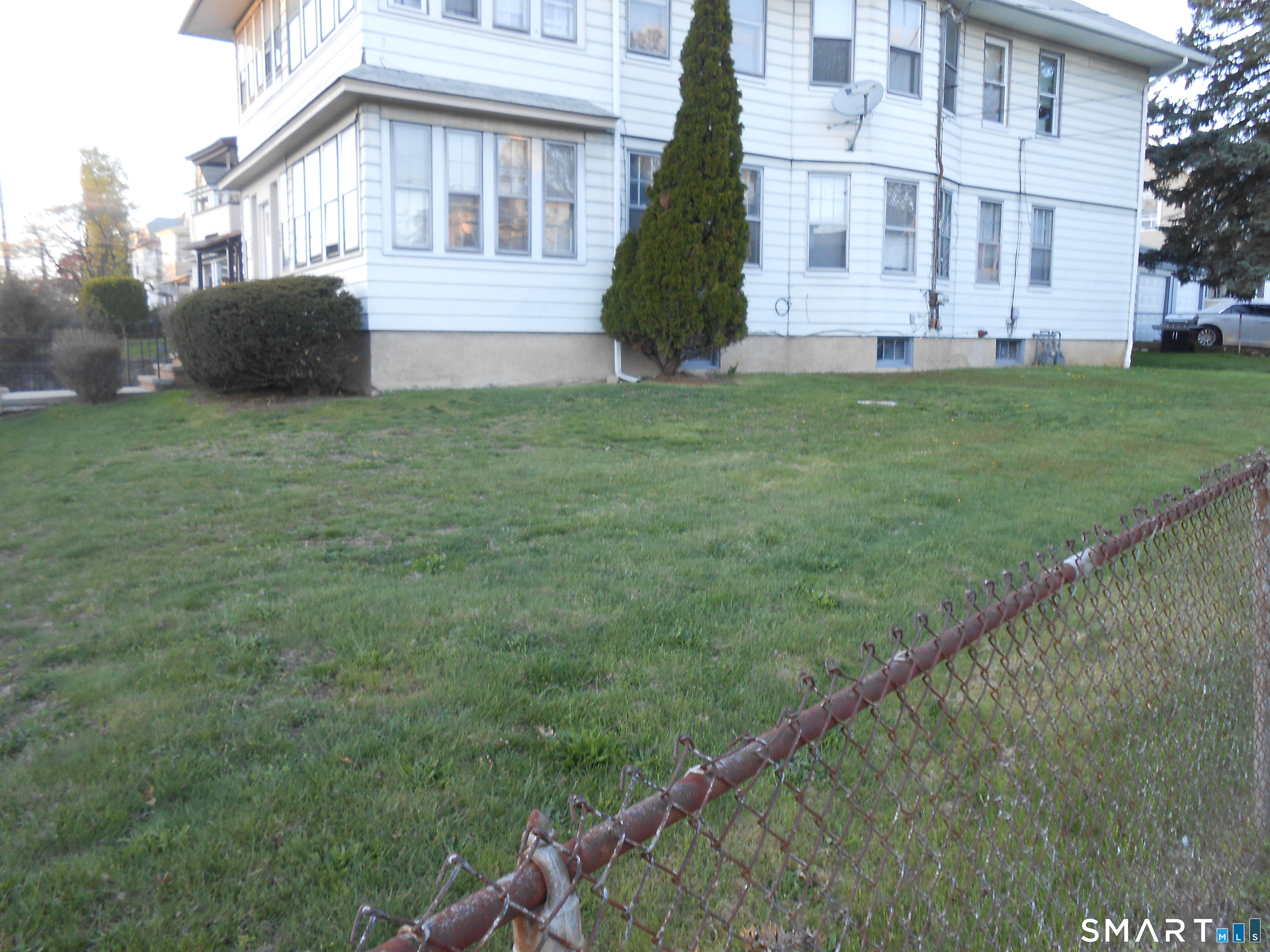 a view of house with yard