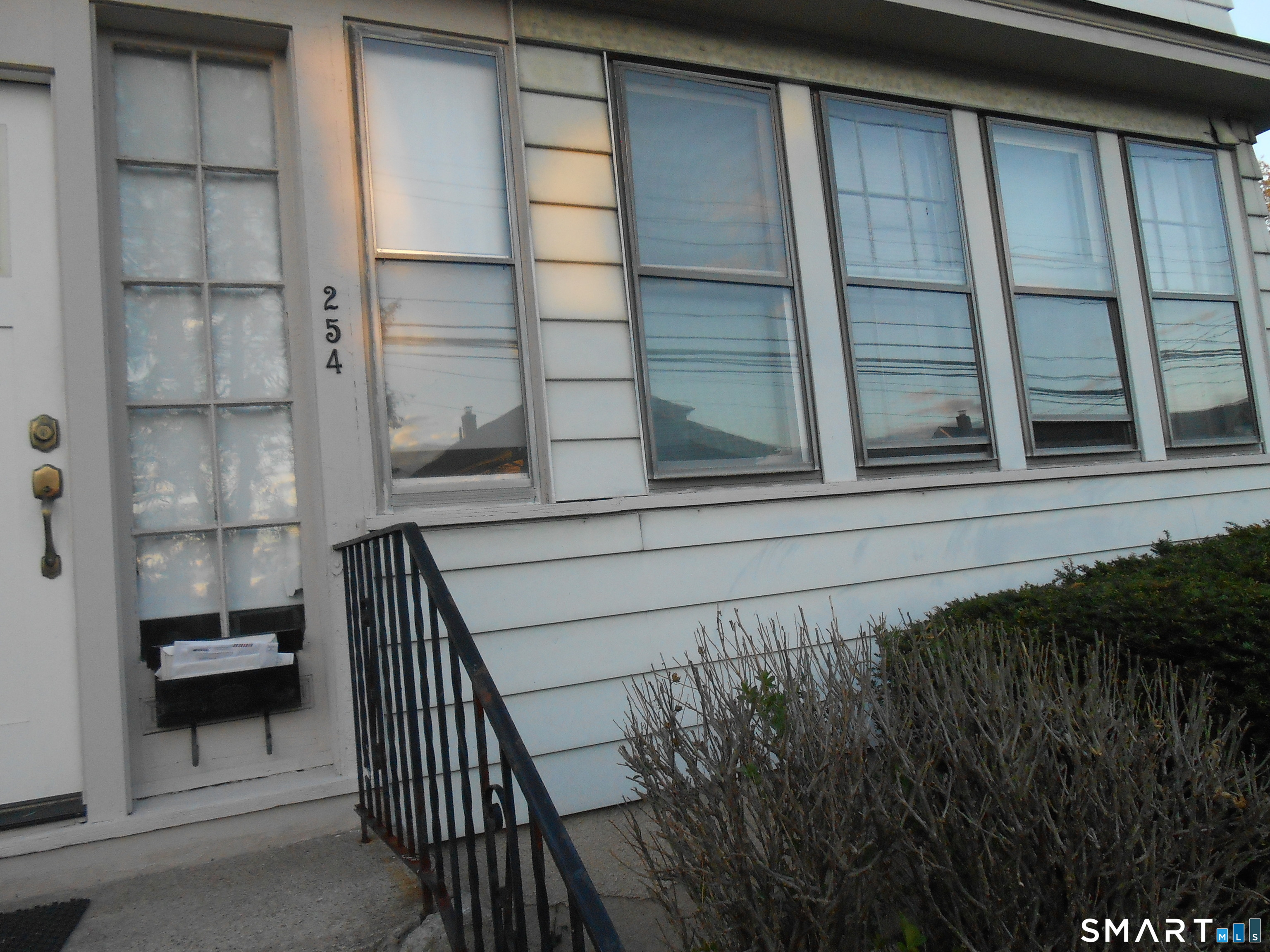 254 Wayne Street Bridgeport, CT 06606 - Photo 2 of 25 a view of balcony and staircase
