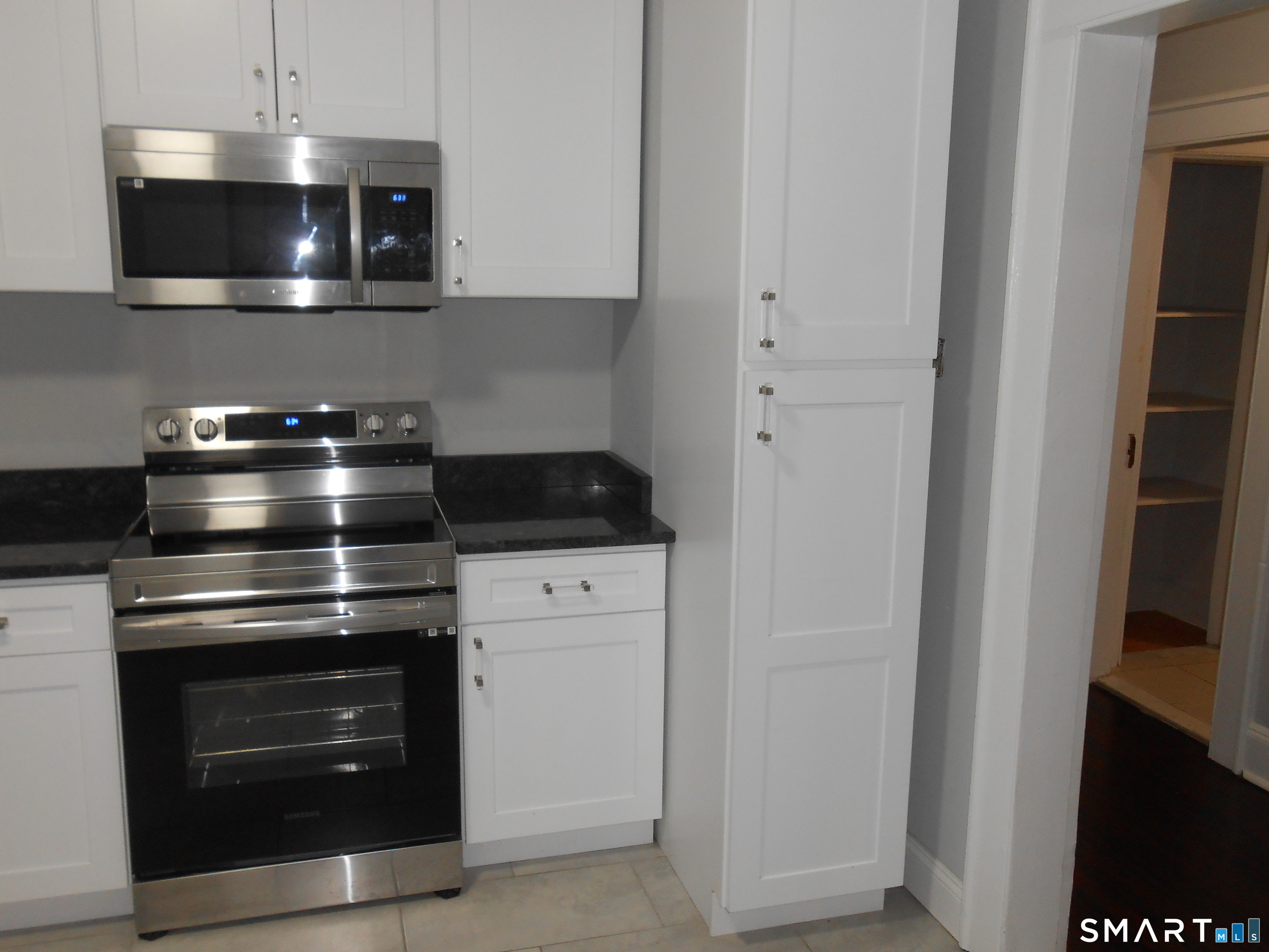 254 Wayne Street Bridgeport, CT 06606 - Photo 24 of 25 a stove top oven sitting inside of a kitchen