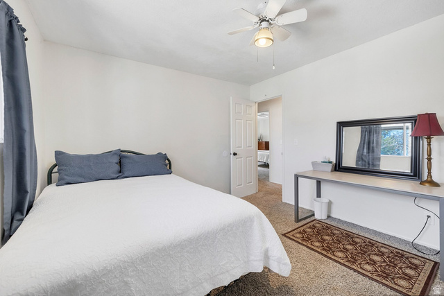 3334 Ute Road St. George, UT 84790 - Photo 16 of 40 Bedroom featuring light carpet and a ceiling fan