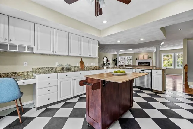 a kitchen with stainless steel appliances granite countertop a sink and cabinets