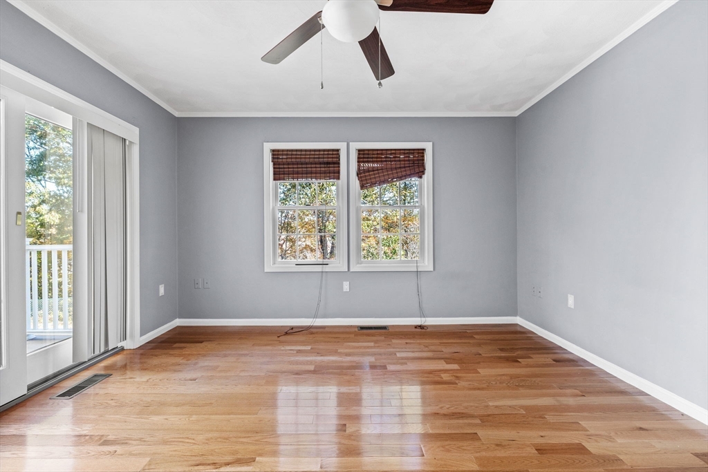 30 Maytum Way, Unit 30 Middleton, MA 01949 - Photo 15 of 42 a view of empty room with wooden floor and window