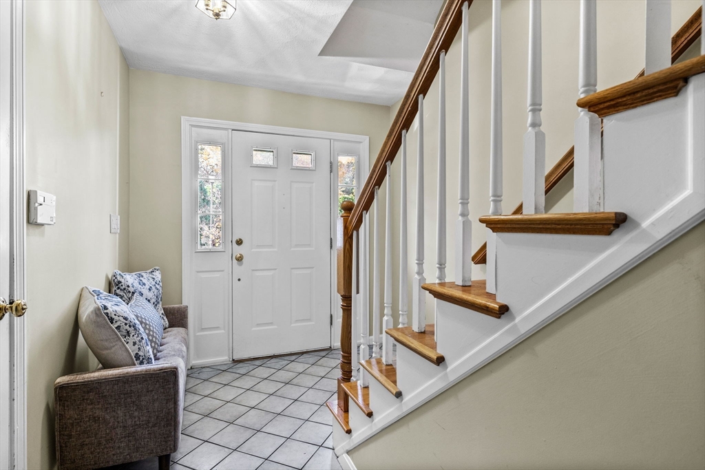 30 Maytum Way, Unit 30 Middleton, MA 01949 - Photo 2 of 42 a living room with furniture and stairs
