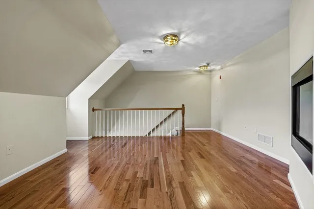 a view of entryway with wooden floor