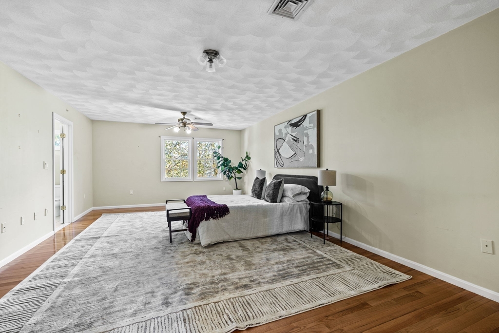 30 Maytum Way, Unit 30 Middleton, MA 01949 - Photo 23 of 42 a living room with furniture and wooden floor