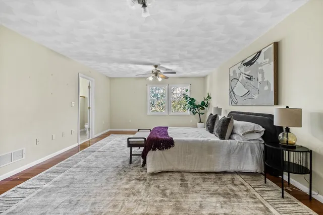 a bedroom with a bed and dresser