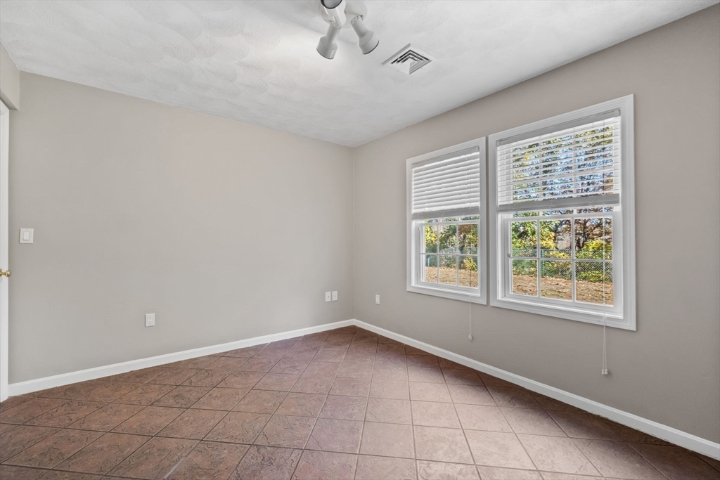 30 Maytum Way, Unit 30 Middleton, MA 01949 - Photo 34 of 42 a view of an empty room with a window