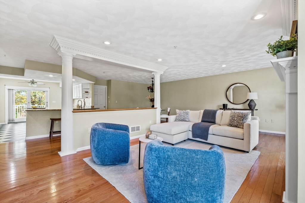 30 Maytum Way, Unit 30 Middleton, MA 01949 - Photo 4 of 42 a living room with furniture and a wooden floor
