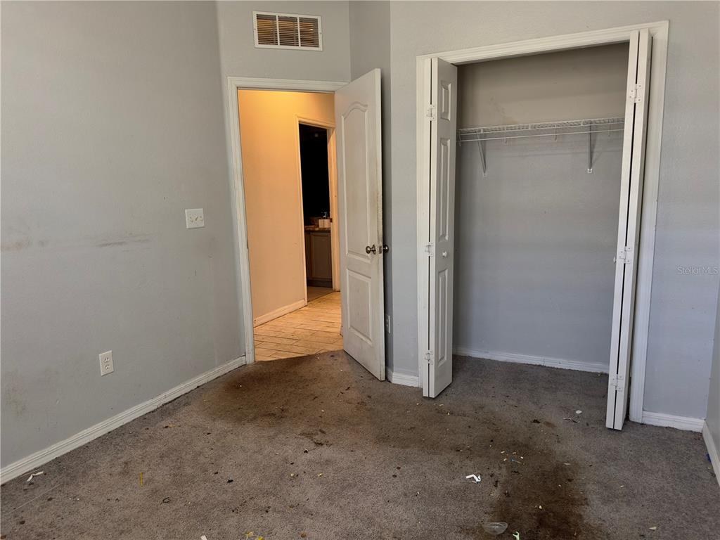 403 Thicket Crest Road Seffner, FL 33584 - Photo 17 of 28 an empty room with closet