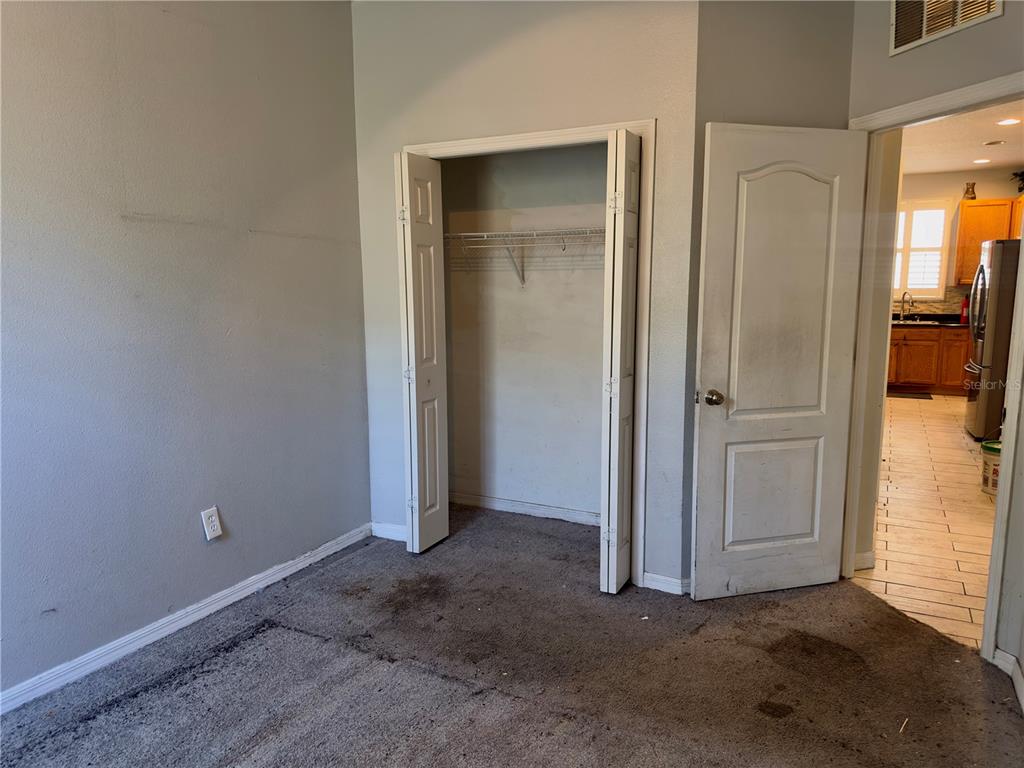 403 Thicket Crest Road Seffner, FL 33584 - Photo 21 of 28 an empty room with a door