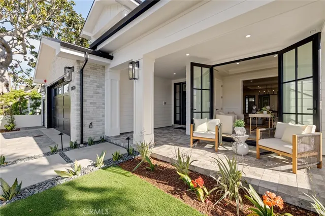 a living room with furniture potted plant and a window