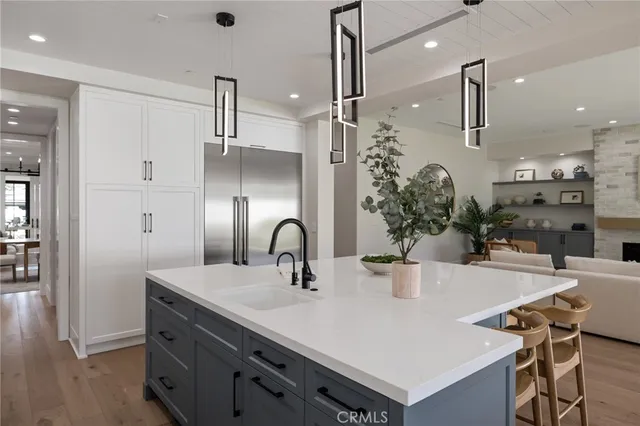 a living room with furniture a fireplace and a table