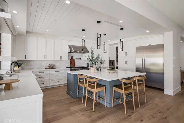 a bedroom with a large bed and furniture