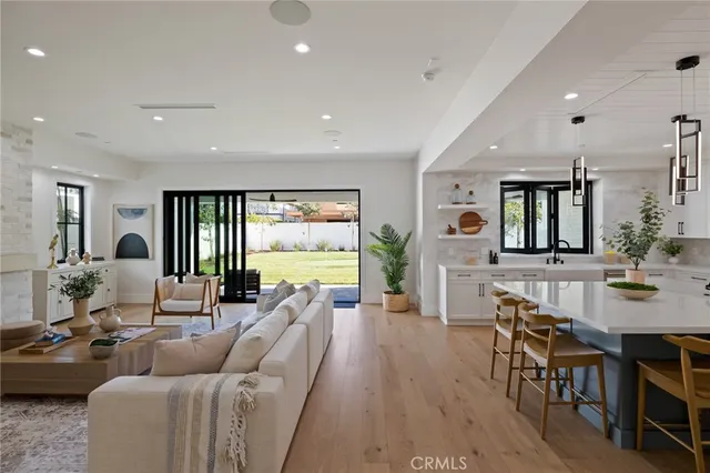 a bathroom with a double vanity sink mirror and bathtub