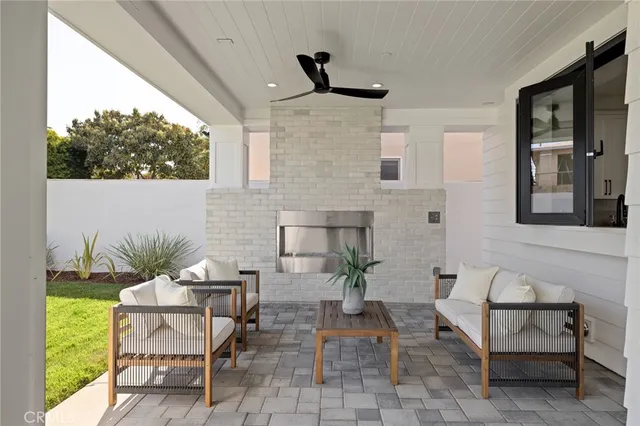 a bedroom with furniture and a potted plant