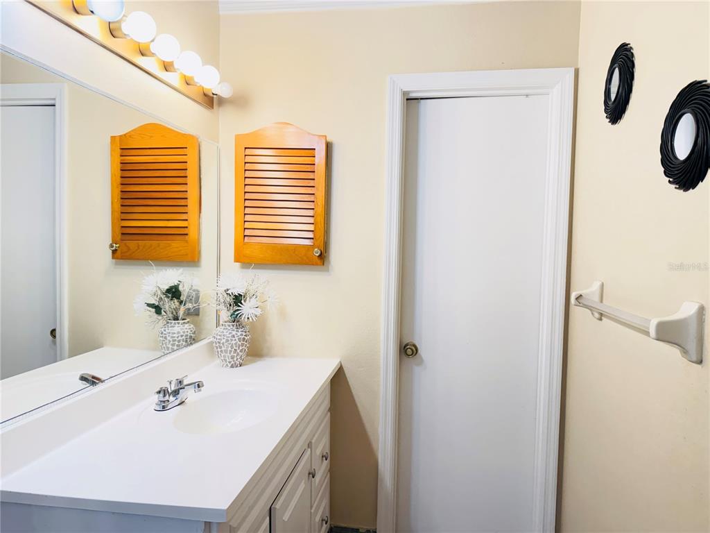 20 Cedar Road Ocala, FL 34472 - Photo 17 of 28 a bathroom with a sink vanity and a mirror