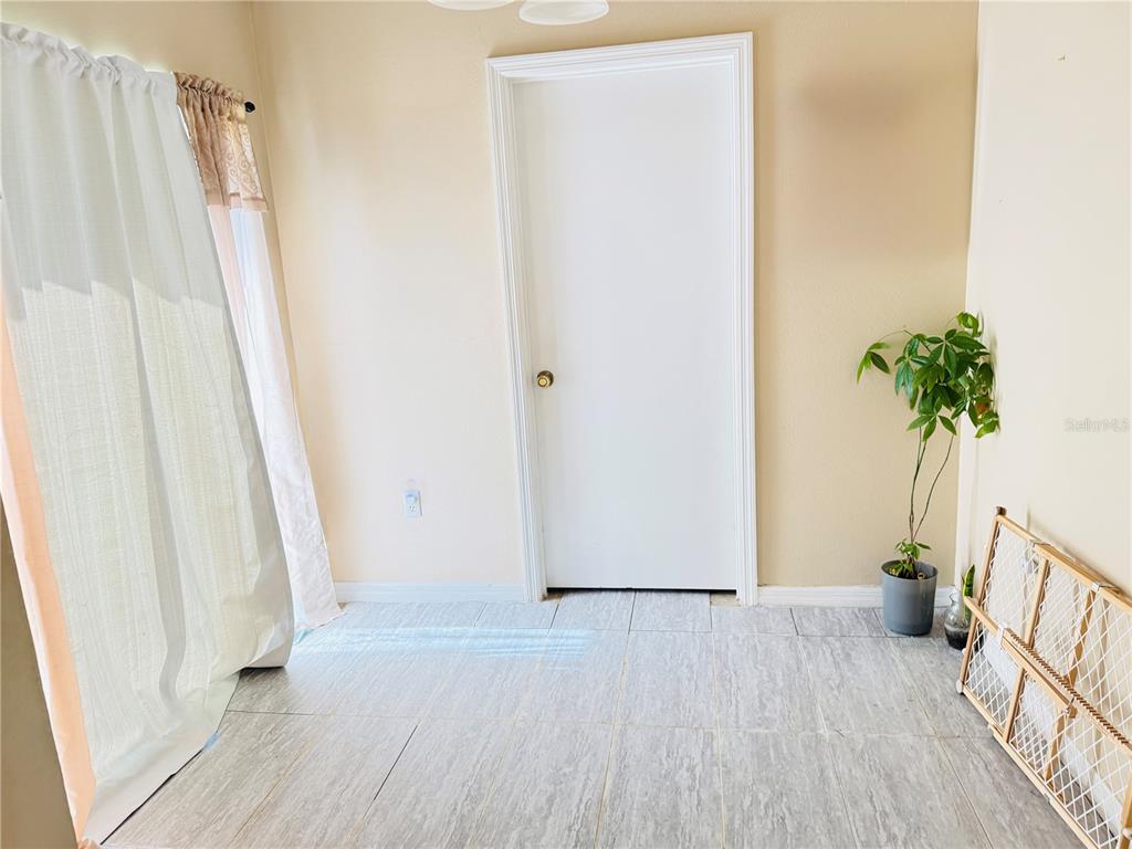20 Cedar Road Ocala, FL 34472 - Photo 18 of 28 a view of a room with wooden floor and front door