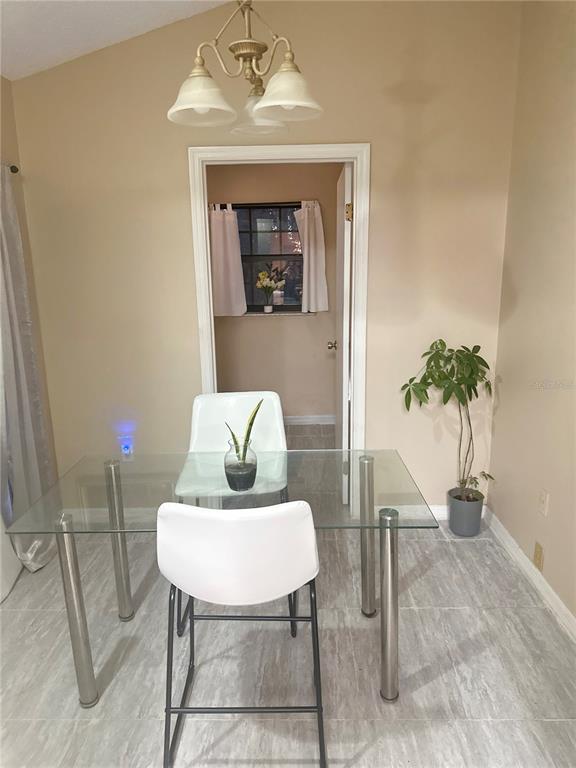 20 Cedar Road Ocala, FL 34472 - Photo 19 of 28 a view of a livingroom with furniture and a potted plant