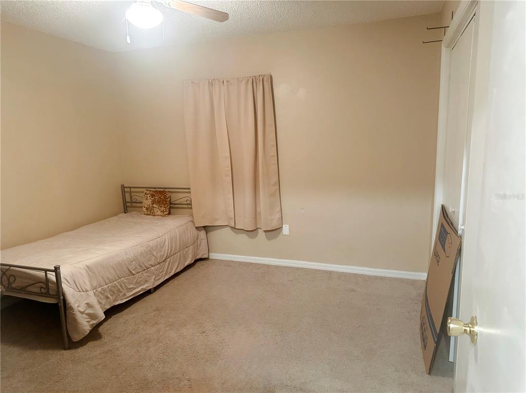20 Cedar Road Ocala, FL 34472 - Photo 22 of 28 a bedroom with a bed and a window