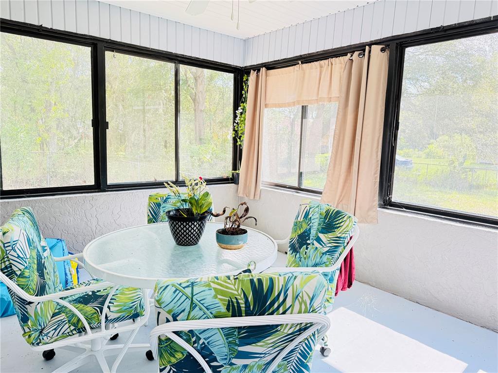 20 Cedar Road Ocala, FL 34472 - Photo 24 of 28 a view of a dining room with furniture window and wooden floor