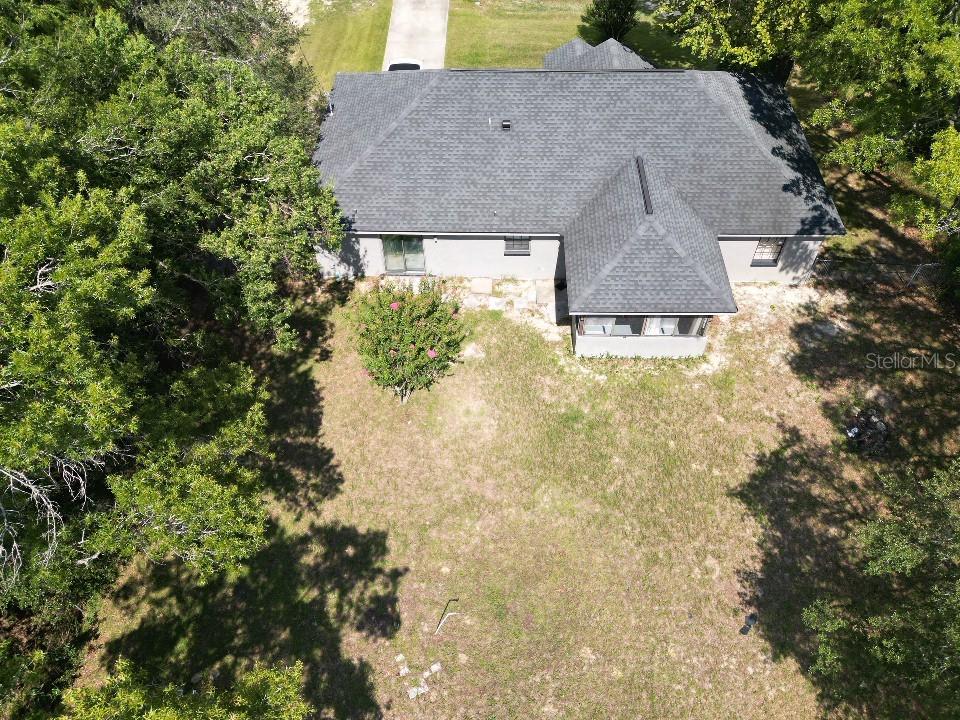 20 Cedar Road Ocala, FL 34472 - Photo 26 of 28 a aerial view of a house with a yard and garage