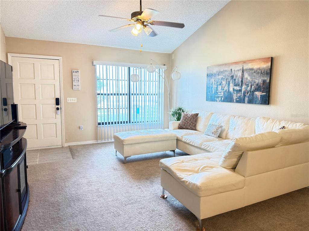 20 Cedar Road Ocala, FL 34472 - Photo 5 of 28 a living room with furniture and a flat screen tv