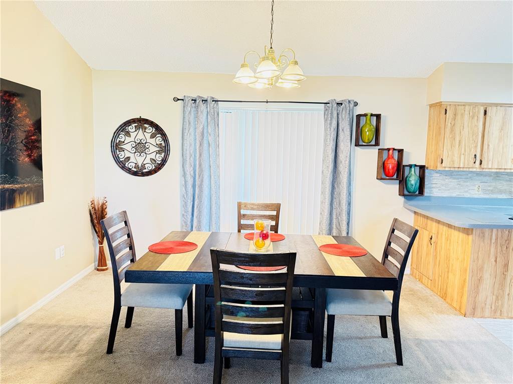 20 Cedar Road Ocala, FL 34472 - Photo 10 of 28 a view of a dining room with furniture window and wooden floor