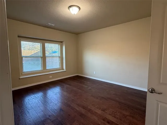 an empty room with closet area