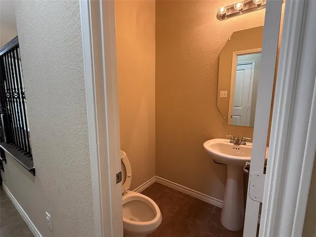 a bathroom with a tub and a sink